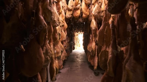Jamon serrano pig legs factory hanging in a industry. Iberian ham elaboration process photo