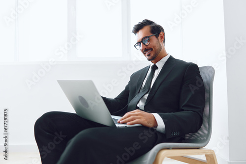 Business man office suit winner laptop victory chair white job corporate happy technology businessman