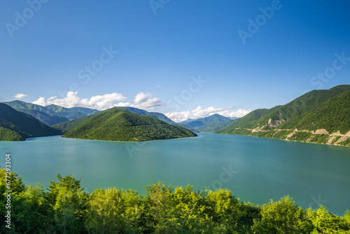 Georgia's Zhinvali Reservoir: A Visual Symphony of Lakeside Splendor and Majestic Caucasus lake in the mountains
