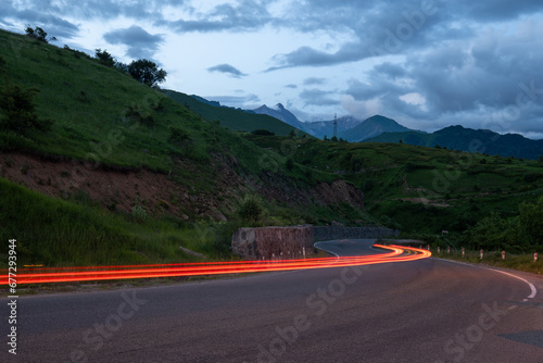 Scenic Drive: Exploring Green Mountain Majesty under Clear Blue Skies on the Highway