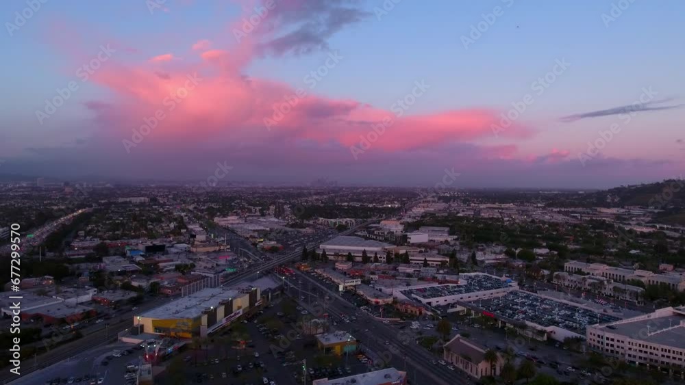 Aerial Forward Shot Of Residential Buildings On City Landscape, Drone Flying Forward Under Cloudy Sky During Sunset - Culver City, California Aerial Forward Shot Of Residential Buildings On City Landscape, Drone Flying Forward Under Cloudy Sky During Sunset - Culver City, California