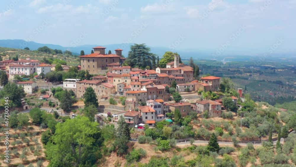 Hilltop village in Tuscany Italy. aerial drone shot of typical Tuscan buildings Hilltop village in Tuscany Italy. aerial drone shot of typical Tuscan buildings