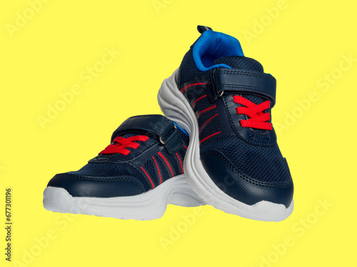 Sports sneakers comfortable with soft sole children's shoes casual isolated on yellow background
