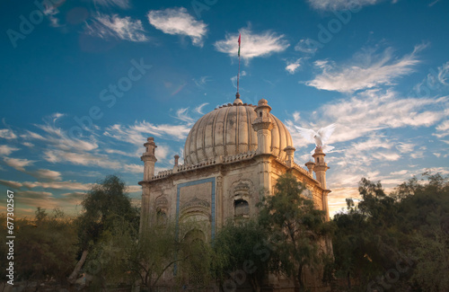 Behold the timeless allure of the Tomb of Bahawalpur. This image encapsulates the fusion of Islamic and Mughal architecture, narrating the cultural legacy of South Asia. With intricate carvings and ma (ID: 677302567)