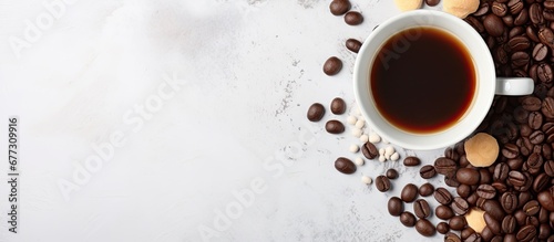 Black coffee and chocolate and coffee beans in glass jar on concrete background Top view space for text Copy space image Place for adding text or design