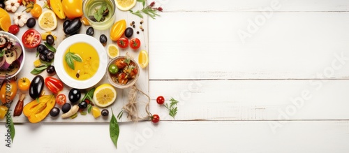 Bird s eye view of vegetarian Mediterranean picnic meal with grilled fruit and veggies on white wooden table with space for text Copy space image Place for adding text or design