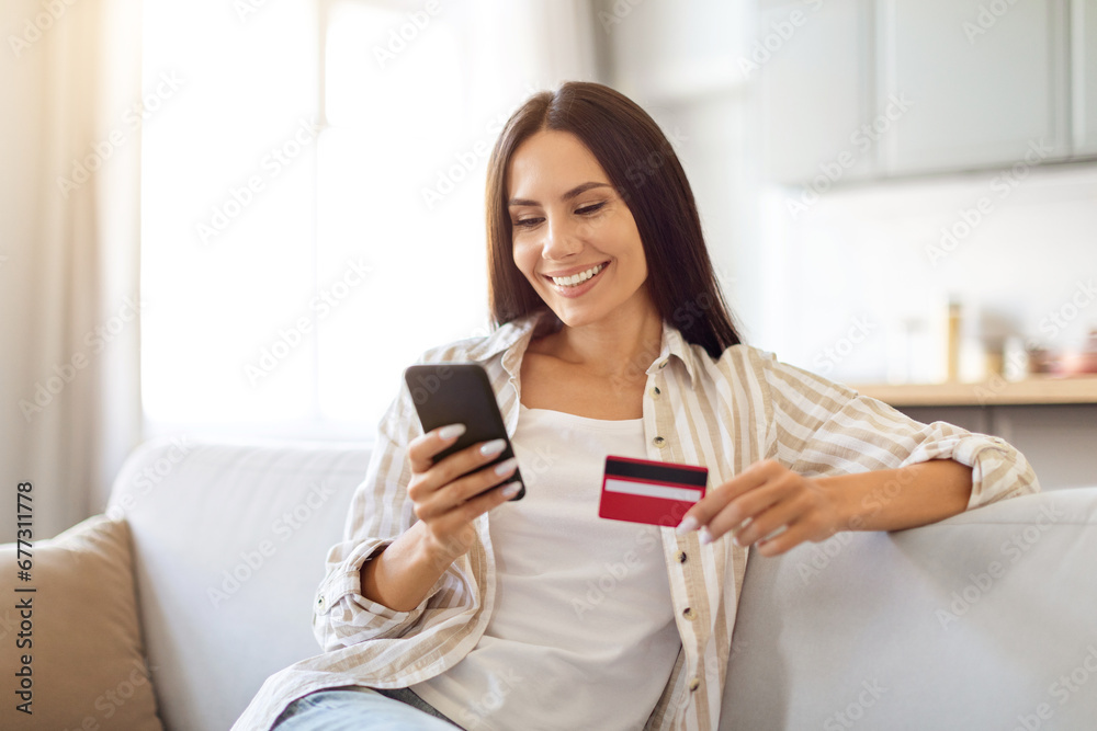 Happy Young Woman Shopping Online With Smartphone And Credit Card At Home Happy Young Woman Shopping Online With Smartphone And Credit Card At Home
