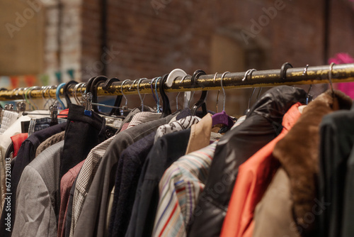 Clothes on the rail, Garage sale, reuse the clothes, eco consumering, Second hand clothes for sale.