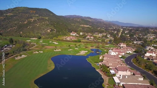 Aerial view of the green landscape of Wildomar city with beautiful hills and lakes on a sunny day photo