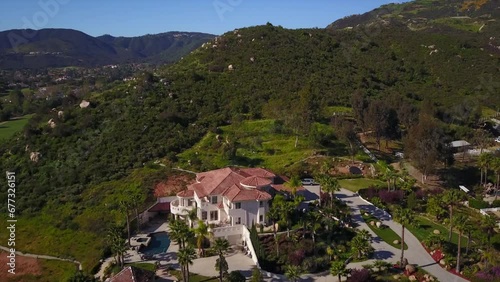 Aerial view of the green landscape of Wildomar city with beautiful hills and lakes on a sunny day photo