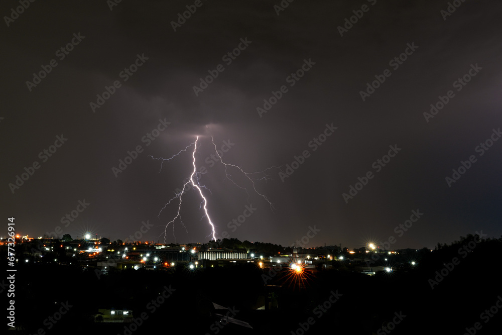 Beautiful Lightning bolt strike Over Kempton Park, Stunning and dangerous power energy that exists in nature as a storm passes over with heavy rain fall and storms