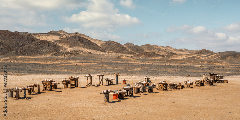 Salt crystals for sale on the side of the road heading to the Cape Cross Seal Reserve, Skeleton Coast, Namibia. Payment is made through honesty boxes. - obrazy, fototapety, plakaty 