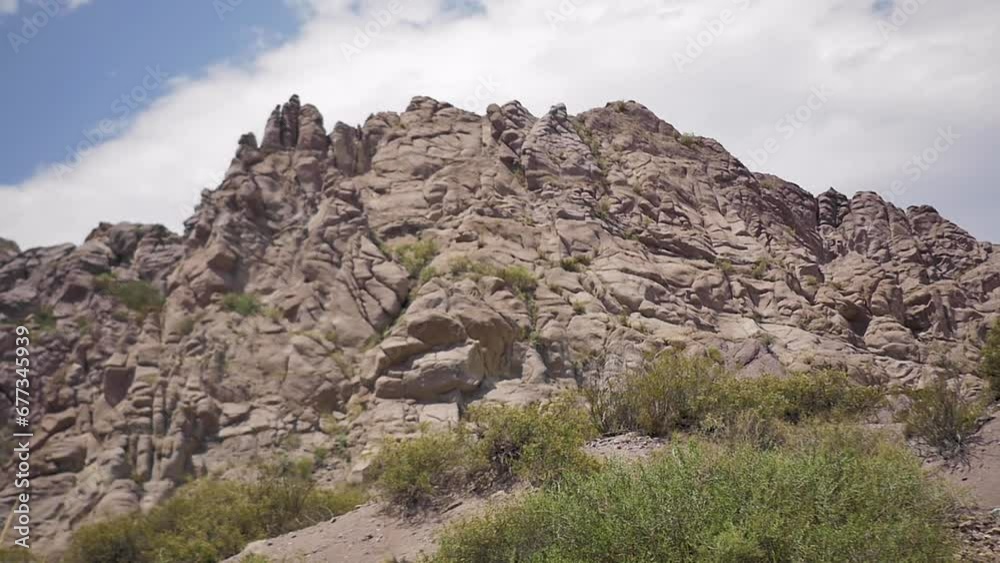 Slow motion camera passing through rock formations of canyon (Canon Atuel) on a desert in South America Slow motion camera passing through rock formations of canyon (Canon Atuel) on a desert in South America