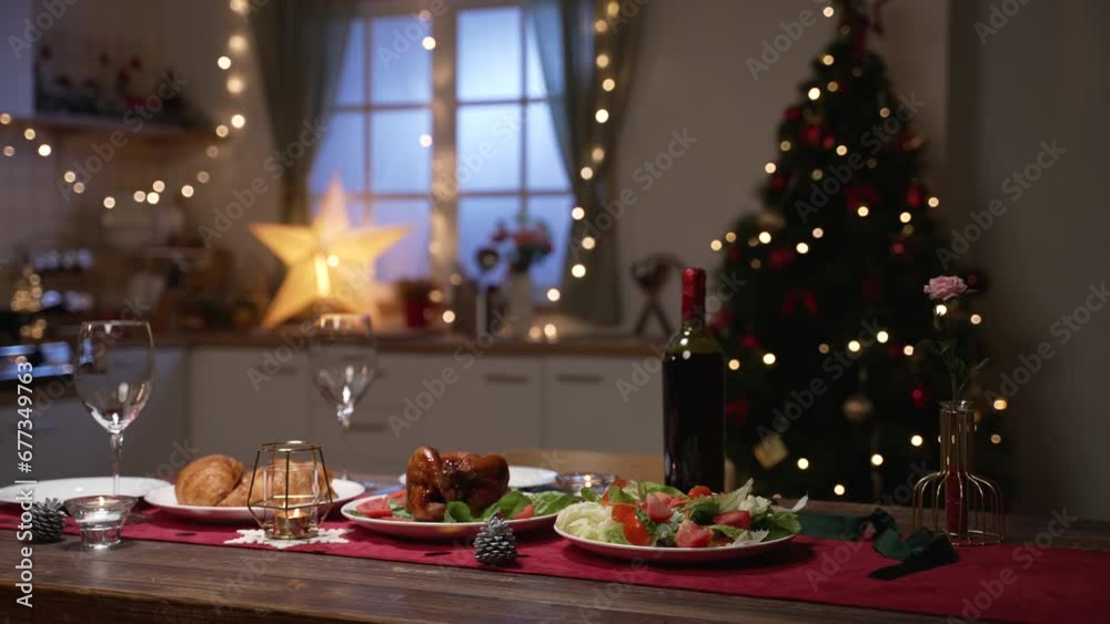 closeup of festive evening dinner for two to celebrate Christmas and new year in a decorated home interior closeup of festive evening dinner for two to celebrate Christmas and new year in a decorated home interior