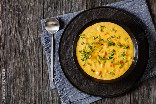 Beer cheese soup with vegetables and thyme