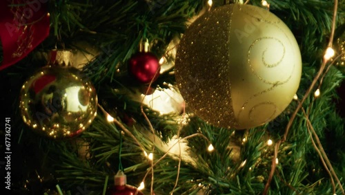 Ligtht coming out through balls and branches of a Christmas tree  photo
