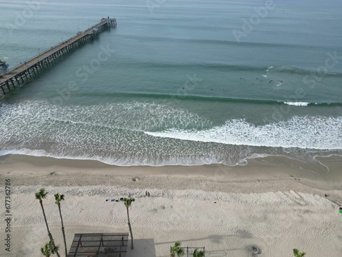 Aerial view over sandy beach and San Clemente Pier on sthe horizon photo