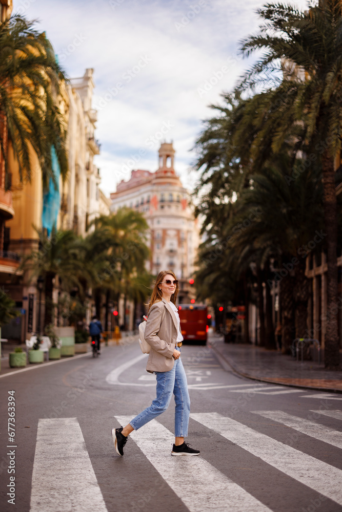 Beautiful woman walking in the city of Valencia, Spain