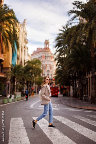 Beautiful woman walking in the city of Valencia, Spain