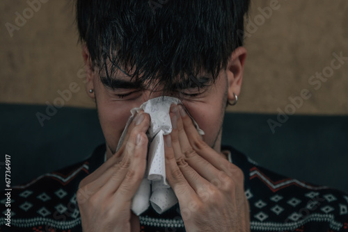 young man at home sick with cold