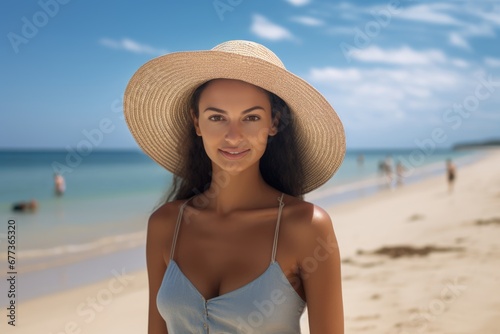 Portrait of a happy lady with beach hat at sand beach. Summer tropical vacation concept. © rabbit75_fot
