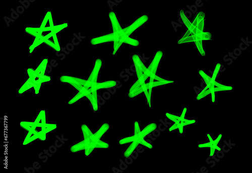 Collection of graffiti street art tags with star symbols in light green color on black background