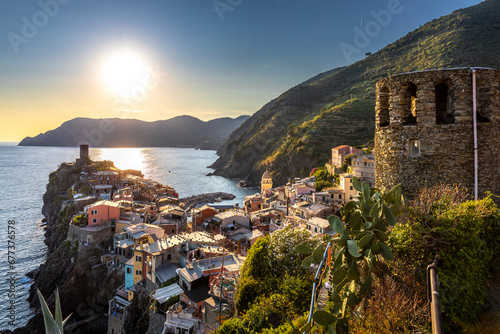 Vernazza, Italy - August 2, 2023: The city seen from the hiking trail. Vernazza is a town in the province of La Spezia, Liguria. It is one of the five cities in the Cinque Terre region photo