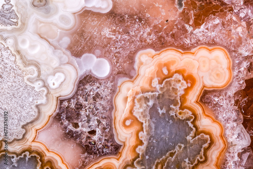 agate, quartz geode in petrified wood macro detail texture. close-up polished semi-precious gemstone.