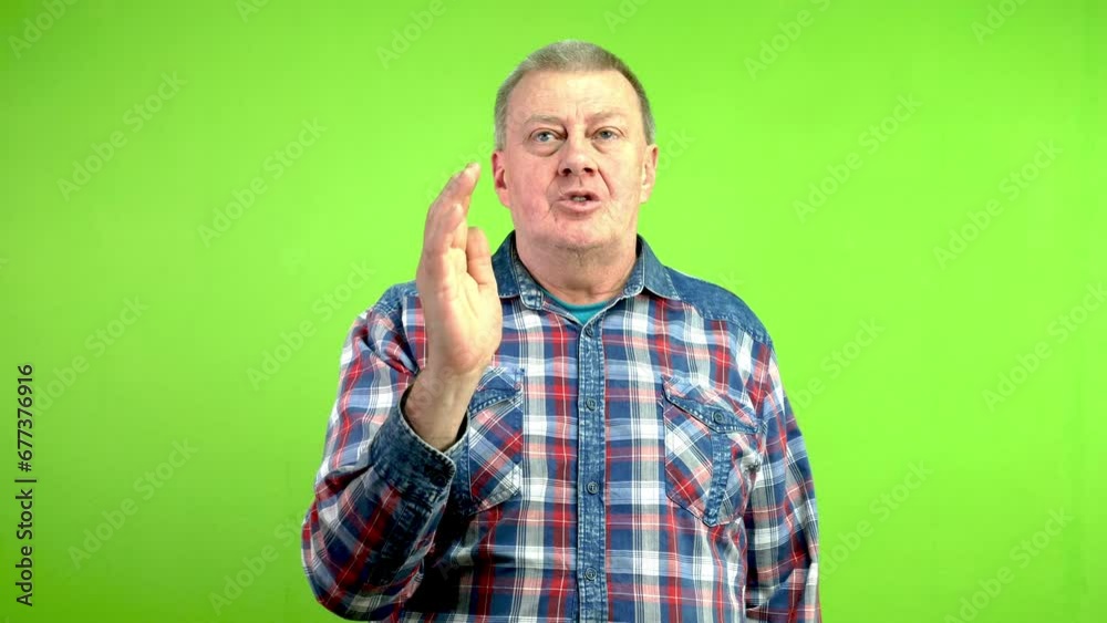 Senior man raises hand wants asks question or make statement asks to speak. Senior man raises hand wants asks question or make statement asks to speak.