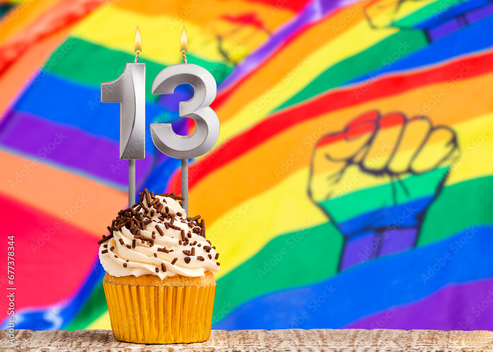 Birthday candle number 13 - Gay march flag background