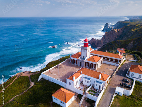 Scenic aerial view of lighthouse at cape Cabo da Roca in sunny spring day, Portugal photo