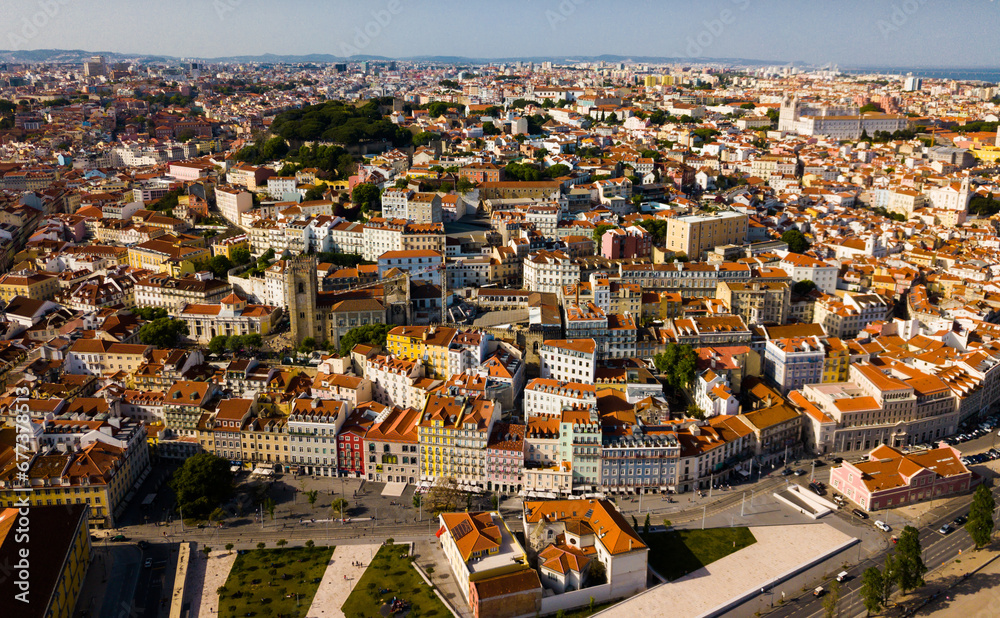 Aerial view of historical centre of Lisbon overlooking medieval Roman Catholic Cathedral and Castle of Sao Jorge, Portugal