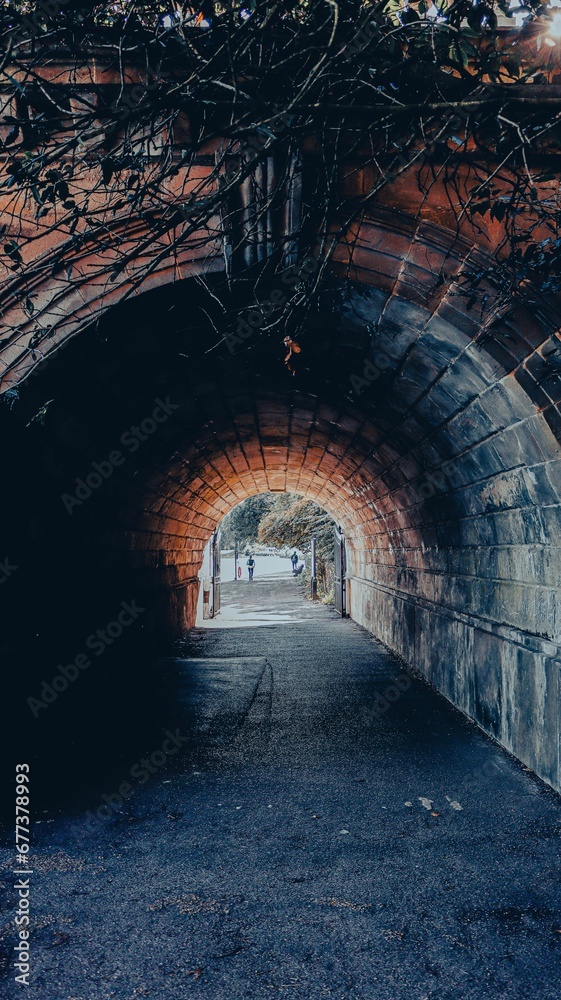 Vertical shot of an arch of a tunnel in the city