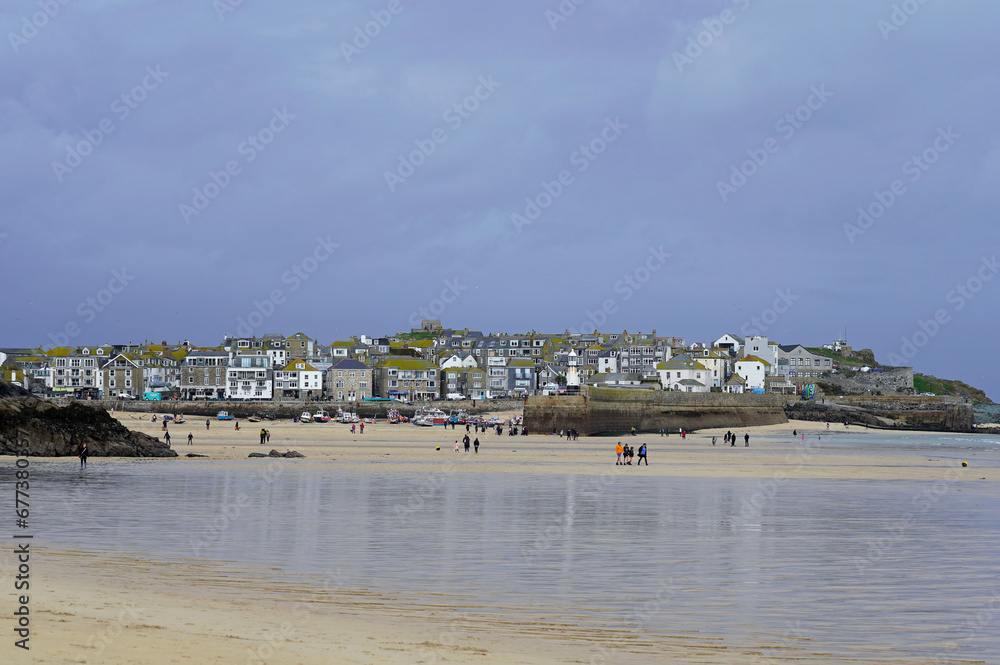 St Ives harbor during low tide, overcast, dramatic sky 