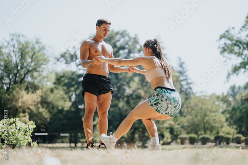 Professional athletes prepare for outdoor physical activity in a sunny park. They practice recreational sports and enjoy a challenging fitness routine in a natural environment.
