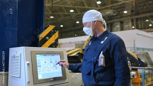 Portrait of Male Factory Operator Is Working With Control Panel At Electrochemical Plant For Nuclear Power Creation. Chemical Reactions To Produce Power. Modern Industrial Equipment In Power Industry. photo