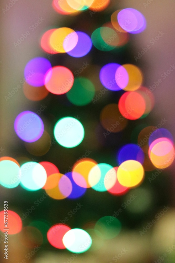 Bokeh lights on a blurred Christmas tree