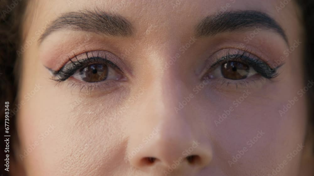 Concept of mixed race diverse model with classy elegant eyeliner make up. Hispanic race woman RED camera. Eyes of beautiful multiethnic female close up. Positive human looking at camera in slow motion Concept of mixed race diverse model with classy elegant eyeliner make up. Hispanic race woman RED camera. Eyes of beautiful multiethnic female close up. Positive human looking at camera in slow motion