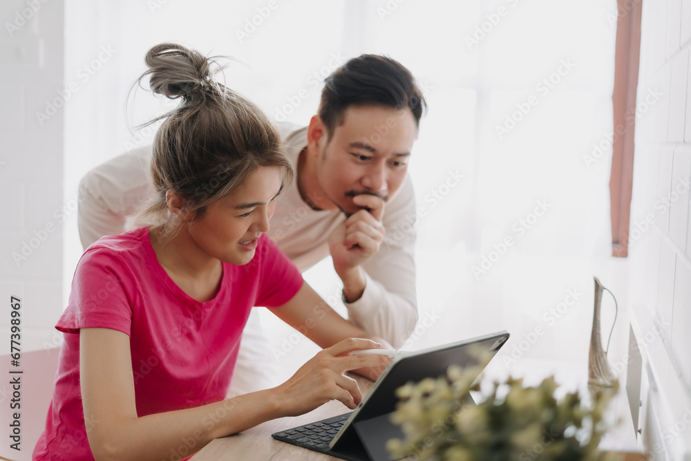 Husband and wife discuss and planing about online advertisement. Husband and wife discuss and planing about online advertisement.