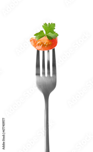 Fork with tasty tomato and parsley isolated on white