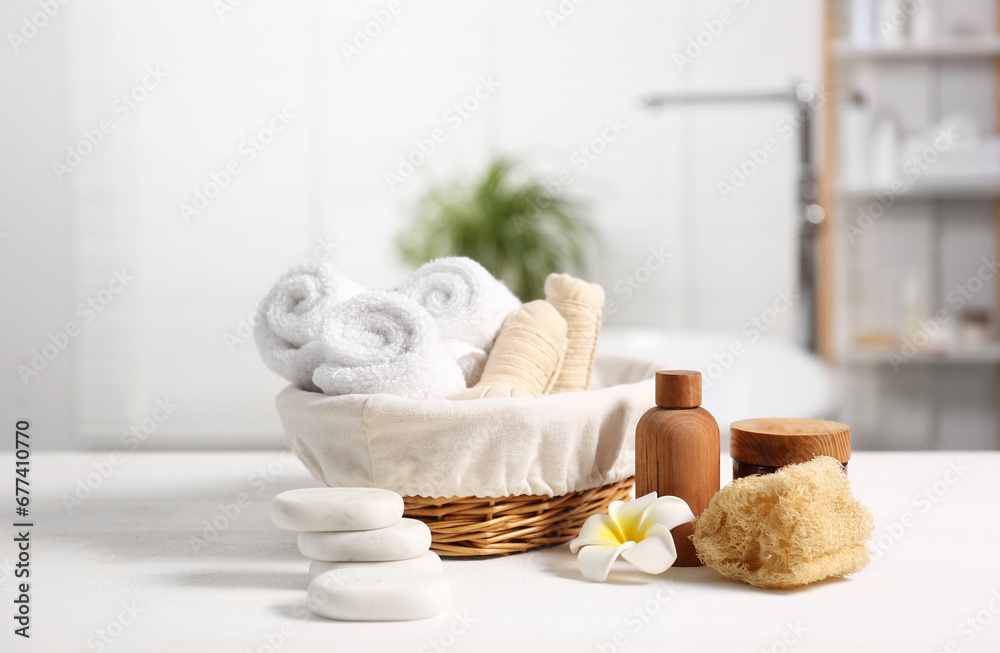 Composition with spa products on white wooden table in bathroom
