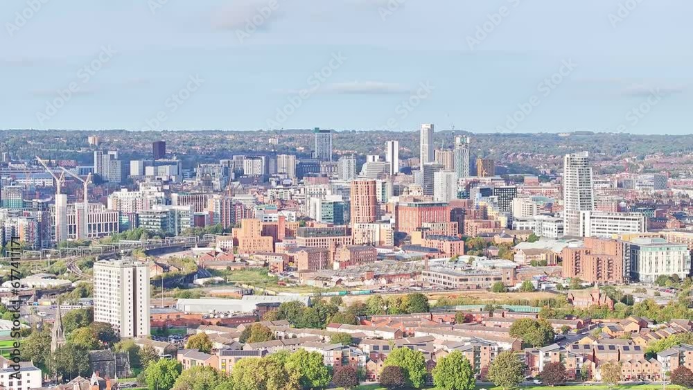Ascending drone shot of Leeds City with Skyline during sunny day in United Kingdom - Panorama view Ascending drone shot of Leeds City with Skyline during sunny day in United Kingdom - Panorama view