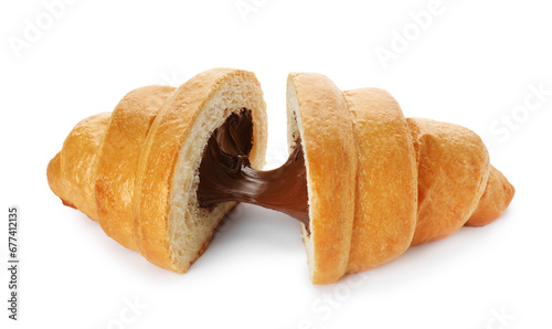 Delicious cut croissant with chocolate isolated on white