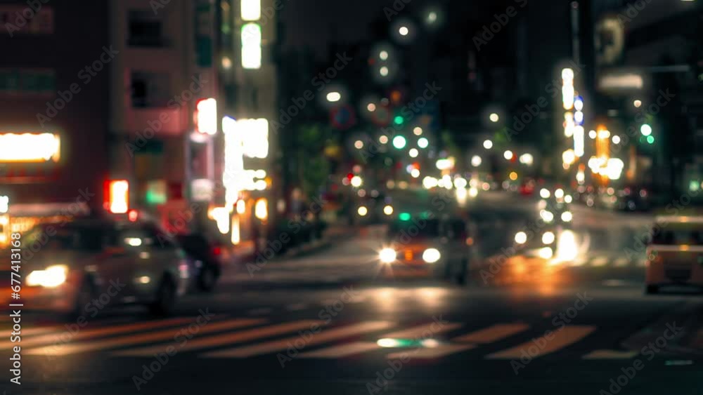 defocused traffic in Tokyo city at night, busy road at rush hour, cars and blurred bokeh lights background. evening city street, urban scene, city transport