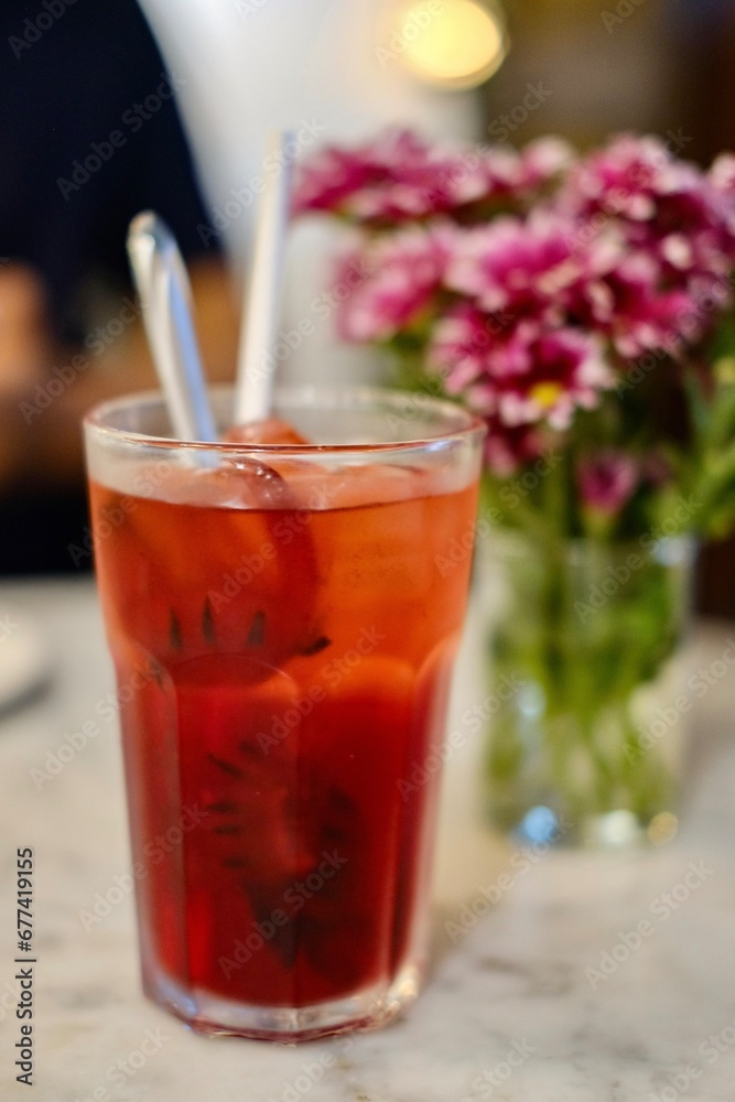 A glass of roselle calyces hibiscus iced tea at Old China Cafe, a Nyonya restaurant near Kwai Chai Hong - Kuala Lumpur, Malaysia A glass of roselle calyces hibiscus iced tea at Old China Cafe, a Nyonya restaurant near Kwai Chai Hong - Kuala Lumpur, Malaysia