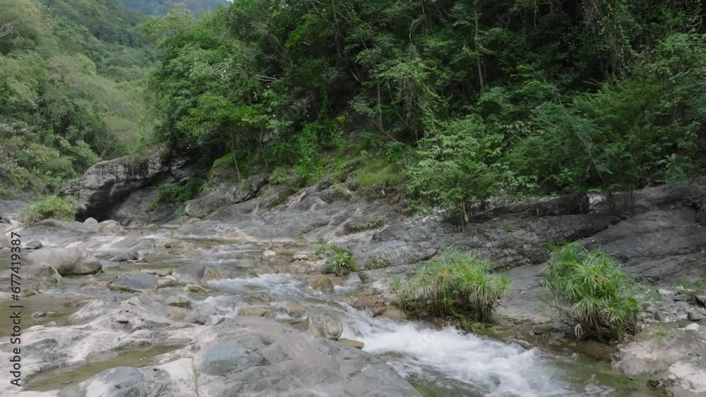 River water flows through the Rocky Canyons in Salto Las Yayitas, El Recodo, Bani, Dominican Republic, Peravia Province. Drone Shot. River water flows through the Rocky Canyons in Salto Las Yayitas, El Recodo, Bani, Dominican Republic, Peravia Province. Drone Shot.