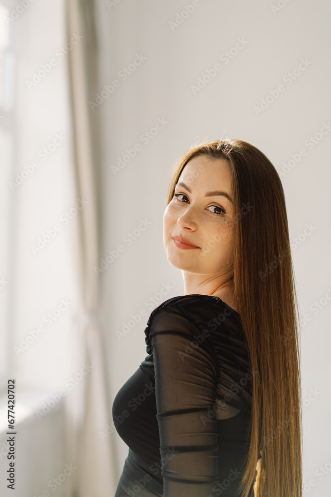 Portrait of young beautiful cute cheerful girl smiling looking at camera over white background. Brunette girl Portrait of young beautiful cute cheerful girl smiling looking at camera over white background. Brunette girl