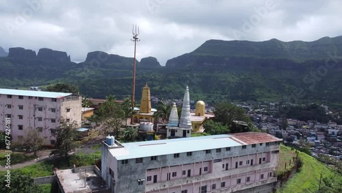 Panoramic aerial view of Nil Parvat sacred temple on the edges of Brahmagiri hills with the view of Trimbakeshwar town in the background, Nashik, Maharashtra, India photo