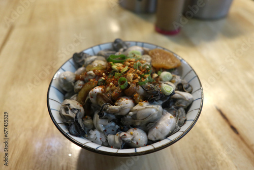 Fresh seafood rice bowl with oysters and cilli photo