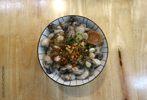 Fresh seafood rice bowl with oysters and cilli photo